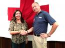 Red Cross Regional Executive Lee Vanessa Feliciano and Puerto Rico Section Manager Oscar Resto, KP4RF, shake hands at the MoU signing on March 3.